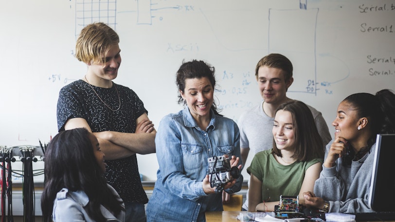 Stock Teachers and students with robots 1 1055843980